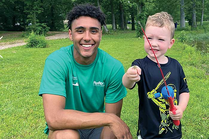 Eddie Gill at fishing clinic for kids